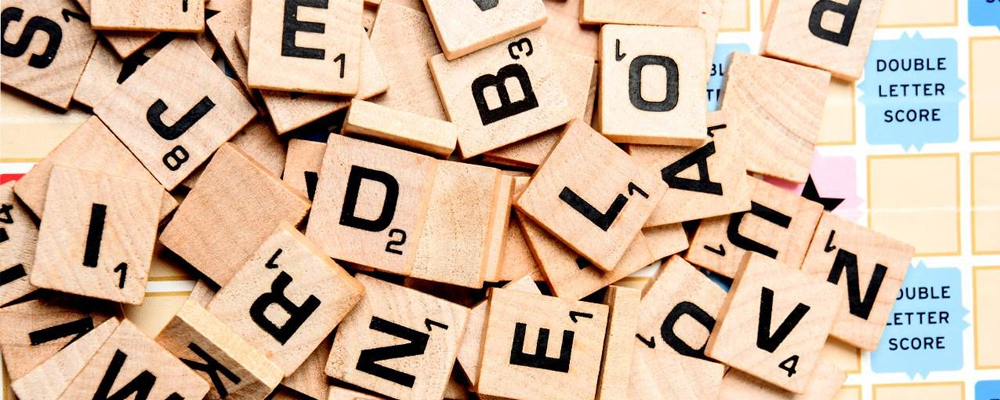 scattered scrabble game pieces
